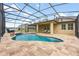 Inviting screened-in pool area featuring a custom pool and spacious patio area for entertaining at 4160 Golden Willow Cir, Apopka, FL 32712
