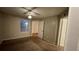 A bedroom with a ceiling fan and walk-in closet is carpeted inside a condo for sale at 5016 Park Central Dr # 2231, Orlando, FL 32839