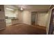 Open-concept living room showcases the kitchen, dining area, and entryway at 5016 Park Central Dr # 2231, Orlando, FL 32839