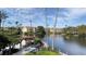 Scenic water view with palm trees, walking path, and lush landscaping at 5016 Park Central Dr # 2231, Orlando, FL 32839