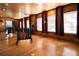 Spacious yoga studio with wood floors, mirrored wall, and adjustable lighting, creating a serene workout environment at 5016 Park Central Dr # 2231, Orlando, FL 32839