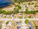 An aerial view of homes in a community, including a house with a screened-in pool at 525 Gentle Breeze Dr, Minneola, FL 34715