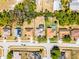 Aerial view of a home highlighting the spacious backyard and screened-in pool at 525 Gentle Breeze Dr, Minneola, FL 34715