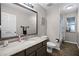 Bathroom featuring a large vanity with modern fixtures and tiled flooring at 525 Gentle Breeze Dr, Minneola, FL 34715
