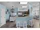 Open kitchen with a breakfast bar and stainless steel appliances at 525 Gentle Breeze Dr, Minneola, FL 34715