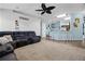 Open-concept living space with a comfortable sectional sofa and kitchen view at 525 Gentle Breeze Dr, Minneola, FL 34715