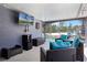 Outdoor patio area featuring a private pool and an outdoor television at 525 Gentle Breeze Dr, Minneola, FL 34715