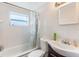 Neat bathroom featuring tiled walls and a clean vanity, creating a functional space at 5380 Barton Dr, Orlando, FL 32807
