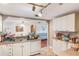 Functional kitchen with white cabinets and essential appliances, ready for culinary creations at 5380 Barton Dr, Orlando, FL 32807
