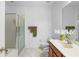 Clean bathroom features a glass-enclosed shower and a vanity with modern fixtures and decor at 5509 Florence Harbor Dr, Orlando, FL 32829