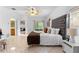 Large main bedroom with neutral walls, tile floors, ensuite bathroom and walkout to a screened porch at 5509 Florence Harbor Dr, Orlando, FL 32829