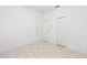 A bright bedroom with white walls and ceramic tile floors at 5509 Florence Harbor Dr, Orlando, FL 32829