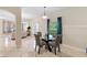Open concept dining area with modern decor and view of living room at 5509 Florence Harbor Dr, Orlando, FL 32829