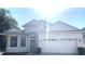 Charming one-story home with a two-car garage and manicured landscaping at 5509 Florence Harbor Dr, Orlando, FL 32829