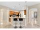 Spacious kitchen with stainless appliances, breakfast bar, and tile floors at 5509 Florence Harbor Dr, Orlando, FL 32829