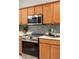 Close-up view of the kitchen featuring stainless steel appliances and attractive mosaic tile backsplash at 5509 Florence Harbor Dr, Orlando, FL 32829