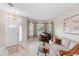 Bright living room showcases tile floors, a bay window, piano, and comfortable seating with stylish accents, perfect for relaxation at 5509 Florence Harbor Dr, Orlando, FL 32829
