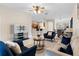 Spacious living room with open floor plan and views of kitchen and dining area at 5509 Florence Harbor Dr, Orlando, FL 32829