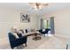 Comfortable living room featuring neutral tones, tile floors, and ample natural light at 5509 Florence Harbor Dr, Orlando, FL 32829