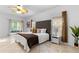 Large main bedroom with tile floors, natural light, and a view to the screened outdoor space at 5509 Florence Harbor Dr, Orlando, FL 32829