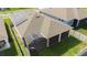 Birds eye view of the home featuring solar panels, a screened-in lanai, and a fenced-in backyard at 5637 Cedar Chase Dr, St Cloud, FL 34771