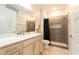 Stylish bathroom featuring dual showerheads and a gray accent tiled shower stall at 5637 Cedar Chase Dr, St Cloud, FL 34771