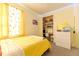 Bright bedroom featuring decorative string lights, a closet, and a dresser at 5637 Cedar Chase Dr, St Cloud, FL 34771