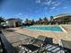 Beautiful community pool with loungers and covered patio area for residents' enjoyment at 5637 Cedar Chase Dr, St Cloud, FL 34771