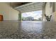 Close up of the epoxy flooring with a street view from the garage at 5637 Cedar Chase Dr, St Cloud, FL 34771