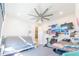 Bright living room featuring futon, TV, and a desk, ideal for modern living at 5637 Cedar Chase Dr, St Cloud, FL 34771
