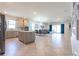 Open concept living area featuring a spacious kitchen, dining area, and sun-lit living room at 5637 Cedar Chase Dr, St Cloud, FL 34771