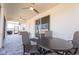 Covered outdoor patio area with ceiling fans, barbecue, and comfortable seating at 5637 Cedar Chase Dr, St Cloud, FL 34771