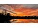 Picturesque sunset view over the neighborhood lake provides a stunning show of colors reflecting in the water at 5637 Cedar Chase Dr, St Cloud, FL 34771