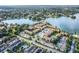 Aerial view of community, showing lake, tennis courts, pool and many trees at 586 Orange Dr # 114, Altamonte Springs, FL 32701