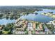 Aerial view of a waterfront condo community surrounded by lush landscaping and mature trees at 586 Orange Dr # 114, Altamonte Springs, FL 32701