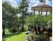 Exterior view of gazebo near lake and trees at 586 Orange Dr # 114, Altamonte Springs, FL 32701