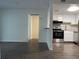 Modern living space with wood flooring and a kitchen featuring stainless steel appliances at 586 Orange Dr # 114, Altamonte Springs, FL 32701