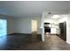 Modern living space with wood flooring and a kitchen featuring stainless steel appliances at 586 Orange Dr # 114, Altamonte Springs, FL 32701
