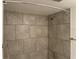 Close-up of a shower featuring neutral tile surround at 586 Orange Dr # 114, Altamonte Springs, FL 32701