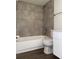 Bathroom featuring a shower and tub combination with neutral tile surround at 586 Orange Dr # 114, Altamonte Springs, FL 32701
