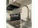 The kitchen sink features stainless steel appliances and grey counters at 586 Orange Dr # 114, Altamonte Springs, FL 32701