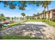 Lakeside sand volleyball court close to building exterior and kayaks at 586 Orange Dr # 114, Altamonte Springs, FL 32701