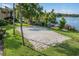 Lakeside sand volleyball court with colorful kayaks nearby at 586 Orange Dr # 114, Altamonte Springs, FL 32701