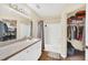 Bathroom features a shower-tub combo and a sink with white cabinetry at 6356 Raleigh St # 1512, Orlando, FL 32835