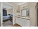 Bright bathroom featuring a vanity with storage and shower-tub combo with neutral walls at 6356 Raleigh St # 1512, Orlando, FL 32835