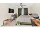 Bright bedroom with carpeting, a ceiling fan, and a mounted flatscreen TV at 6356 Raleigh St # 1512, Orlando, FL 32835