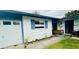 Exterior view with a garage and garden bed at 6429 Voltaire Dr, Orlando, FL 32809