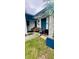 Home's covered front porch offers an entry point to the charming two-story residence at 6429 Voltaire Dr, Orlando, FL 32809