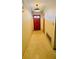 Inviting hallway featuring a solid wood front door and neutral wall color at 6429 Voltaire Dr, Orlando, FL 32809