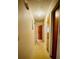 Hallway leading to various rooms, brightened by an overhead light fixture at 6429 Voltaire Dr, Orlando, FL 32809
